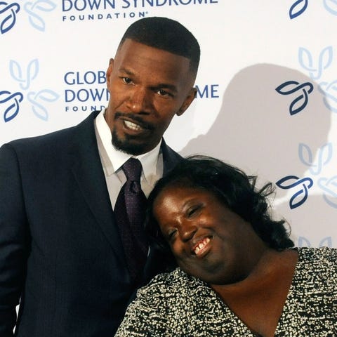 Actor Jamie Foxx poses for pictures with his siste