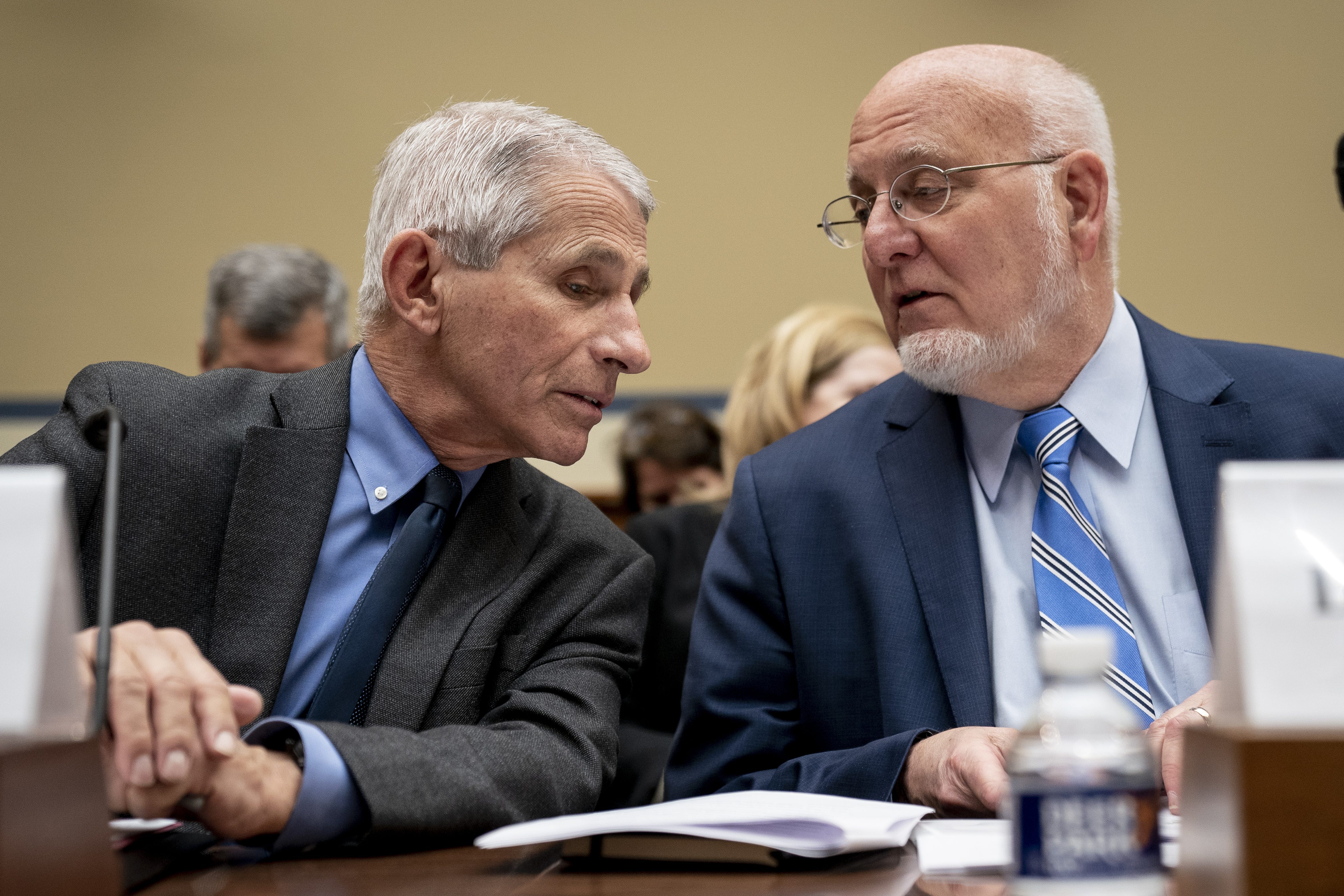 Drs. Anthony Fauci, the nation's top infectious disease expert, left, and Dr. Robert Redfield, the director of the CDC, at a House committee hearing about the coronavirus on March 11.