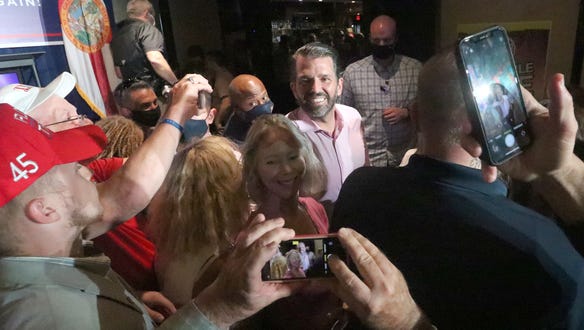 Donald Trump Jr. visits with a crowd following his speech, Wednesday, October 28, 2020 during a campaign stop for his father, President Donald Trump, at Volusia Top Gun in Daytona Beach.