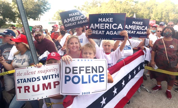 A large crowd waits for Donald Trump Jr. on Wednesday, October 28, 2020 during a campaign stop for his father, President Donald Trump, at Volusia Top Gun in Daytona Beach.