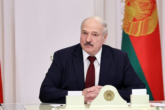 Belarusian President Alexander Lukashenko attends a meeting in Minsk, Belarus, Tuesday, Oct. 27, 2020.