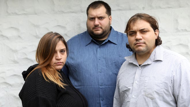 LaRosa, center, pictured with his sister, Johanna, and brother, Carmen, after the death of their parents in October 2020.
