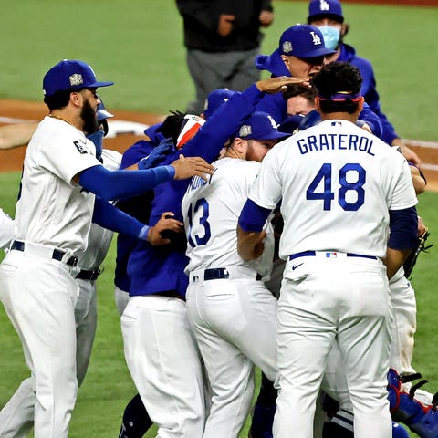 Dodgers players celebrate after the final out.