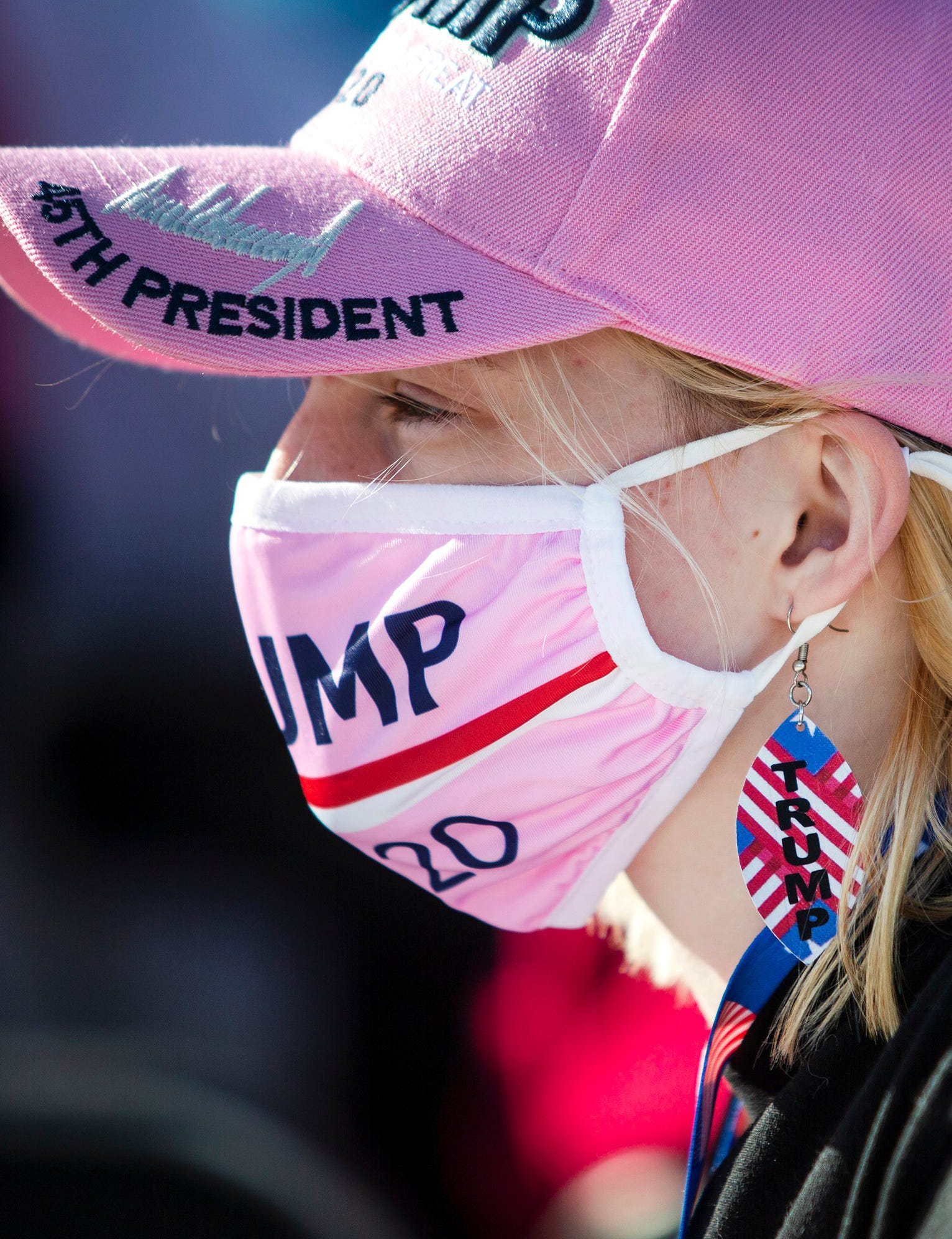 Justina Movall waits for the arrival of President Donald Trump before a Make America Great Again Rally outside the Des Moines International Airport on Oct. 14, 2020 in Des Moines, Iowa.