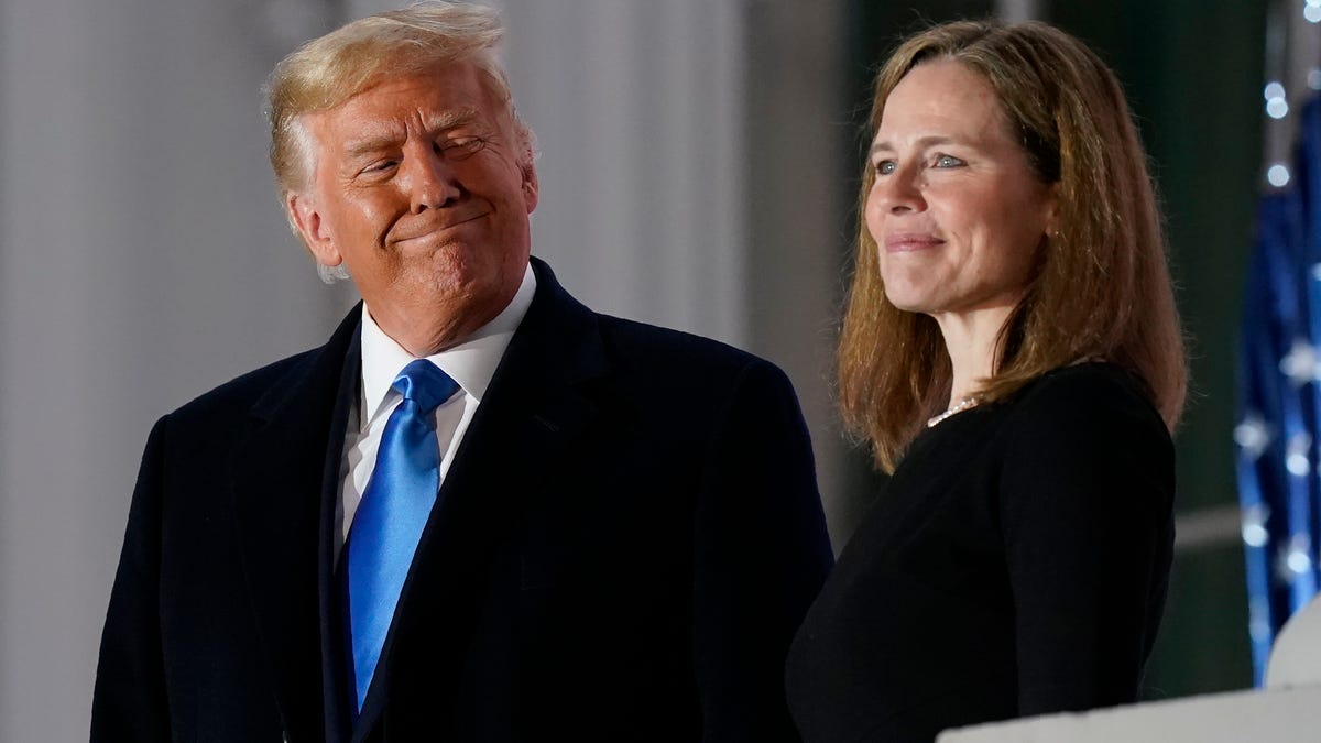 President Donald Trump and Justice Amy Coney Barrett at the White House in Washington, D.C., on Oct. 26, 2020.