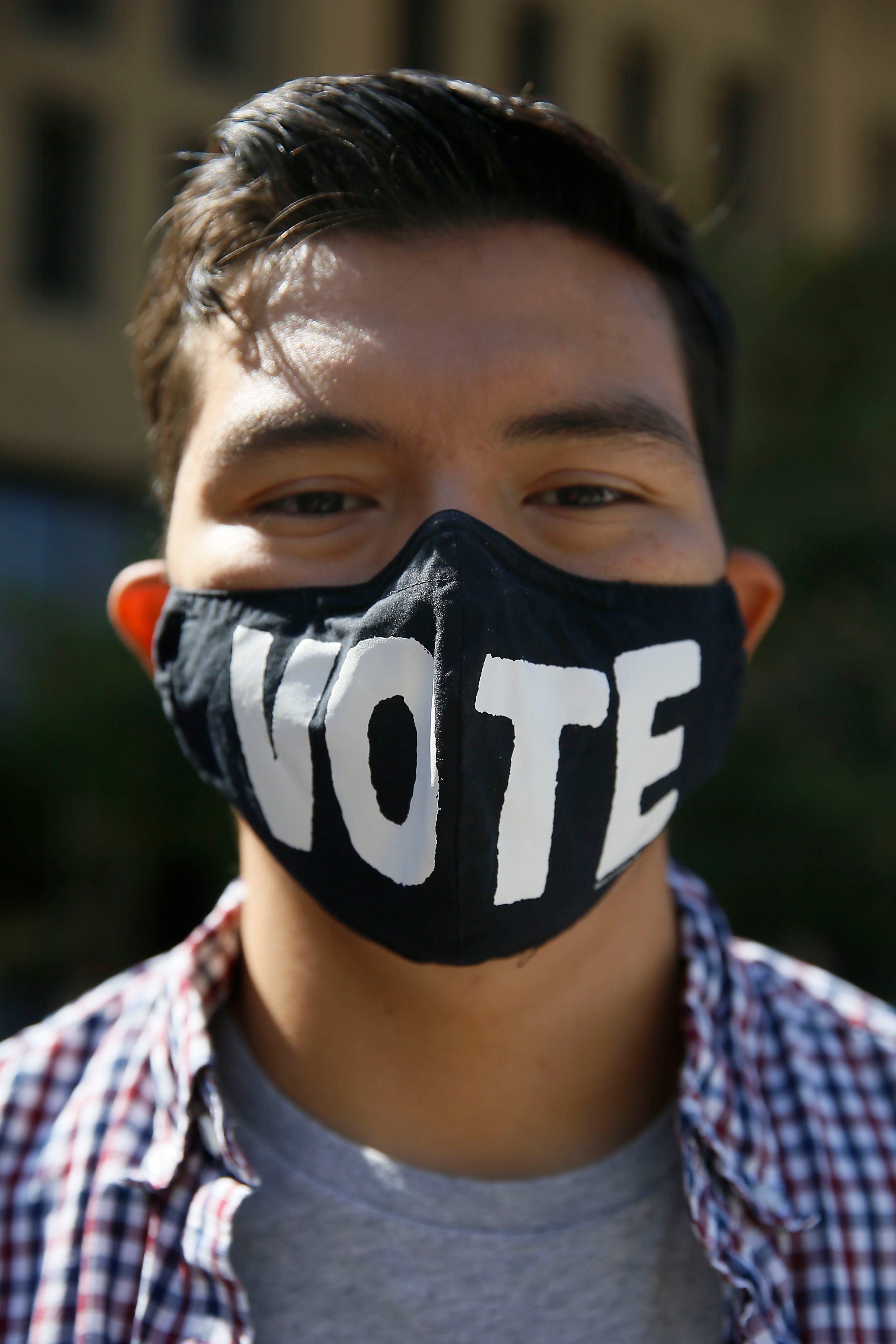 Student wears a mask that reads