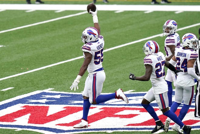 Buffalo Bills' Jerry Hughes, left, celebrates his interception during the second half of an NFL football game against the New York Jets, Sunday, Oct. 25, 2020, in East Rutherford, N.J. (AP Photo/Frank Franklin II)
