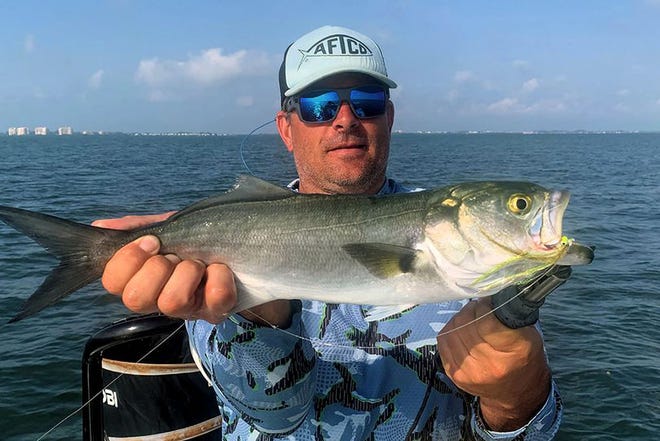Jake Ciesielczk of Phoenix caught this bluefish while fishing Sarasota Bay with Capt. Rick Grassett recently.