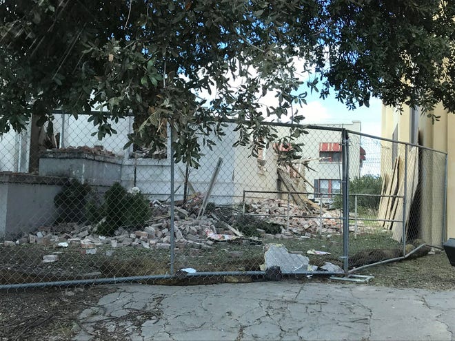 Demolition begins at the former apartment building at 236-238 W. Beauregard Ave. Wednesday, Oct. 28, 2020. The building was 110 years old.
