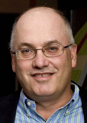Billionaire hedge fund manager Steve Cohen, pictured attending a Dec. 10, 2009, benefit in New York, had his bid to buy the New York Mets approved Friday by Major League Baseball owners.