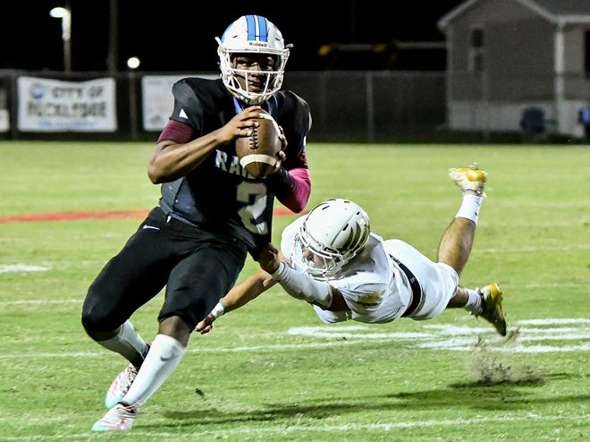 Rockledge QB Elias Allen is dragged down by Viera's Nolan Helton during their game Friday Oct. 30, 2020.Craig Bailey/FLORIDA TODAY via USA TODAY NETWORK