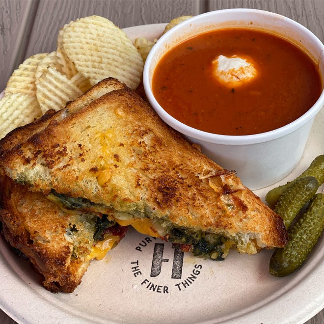 The Classico Toastie at Harvey's Cheese is made with aged cheddar, smoked mozzarella, sun-dried tomato, and arugula pesto sandwiched between two toasted slices of white buttermilk bread.