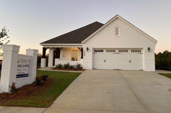 A model home sits in McClain Landing in east Prattville. Construction started in McClain in 2020. One-story, ranch-style homes and two-story traditional designs are under construction on flat terrain in the Stone Martin Builders development located off McQueen Smith Road.
