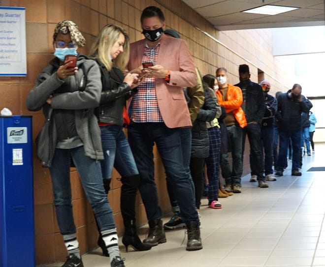 A line to obtain an absentee ballot begins in the lower level of the Novi Civic Center on Nov. 2, 2020. On Nov. 2, 2021, voters will elect three Novi City Council members and the mayor.