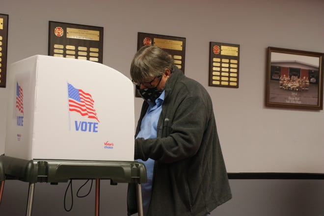 A person votes at the Deep Run Volunteer Fire Department Tuesday, Nov. 3, 2020, on Election Day.
