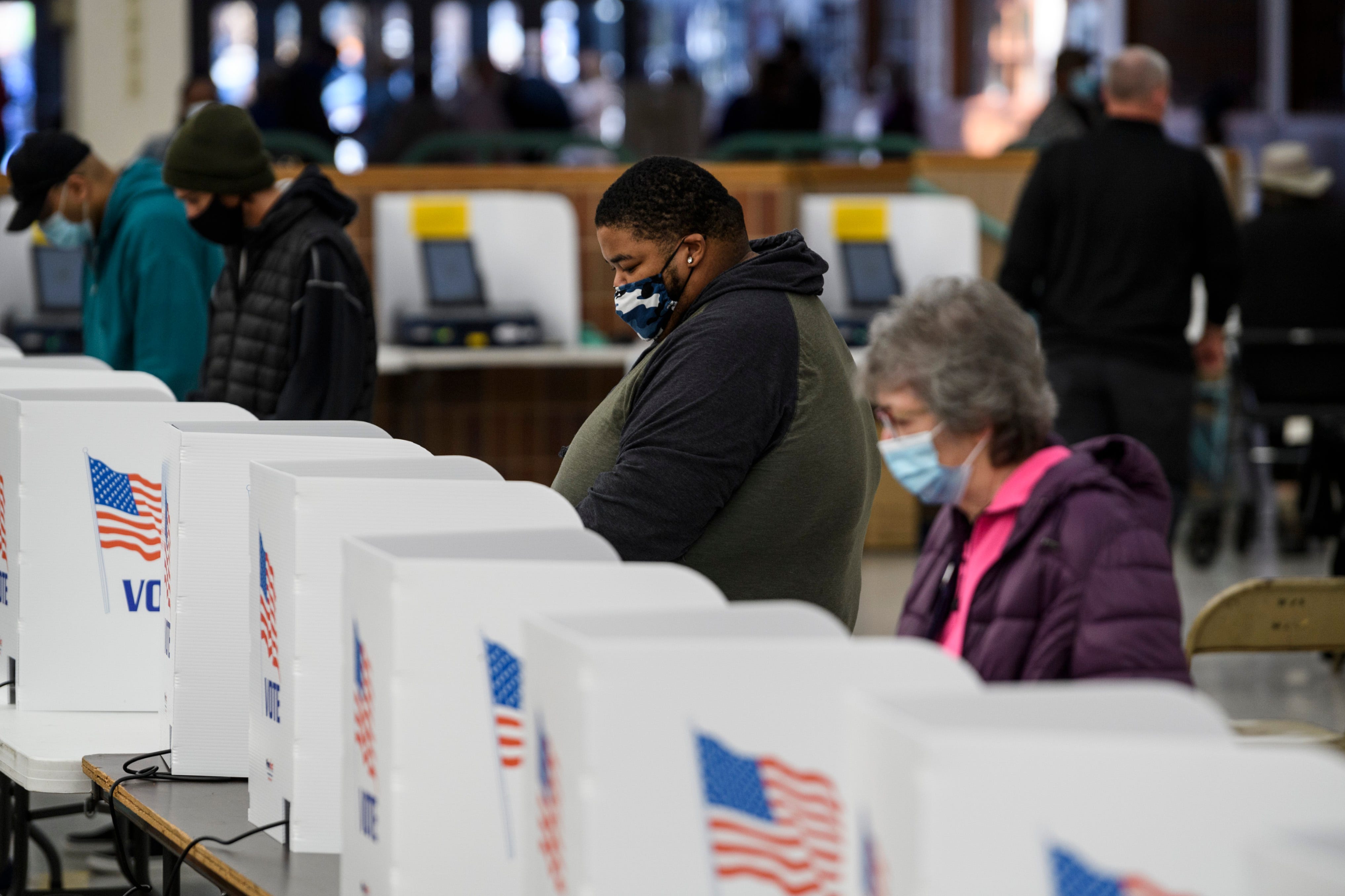 Voters cast ballots on Election Day at Washington Square Mall in Evansville, Ind., Tuesday, Nov. 3, 2020.