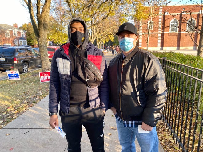 Rasul Freelin, right, a police sergeant, and his son, Diata Freelin, voted for Joe Biden Tuesday at an elementary school on Chicago’s Far Southwest Side. "He has a sense of fairness and respectful interactions for all, regardless of what they may believe,” said Rasul Freelin.