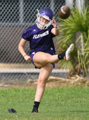 Kindree Sullivan practices her kicking technique during Fletcher's football practice in preseason.  Sullivan, an All-Gateway Conference soccer forward who is also captain of the girls basketball team, made her football debut Monday against First Coast.