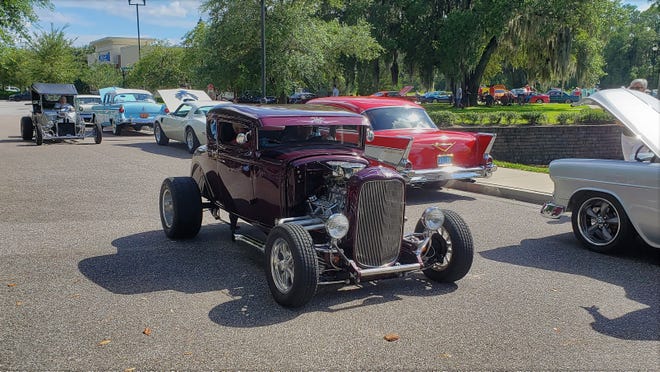 Hot rods cruise for parking spots at a recent Cruise Fruit Cove.