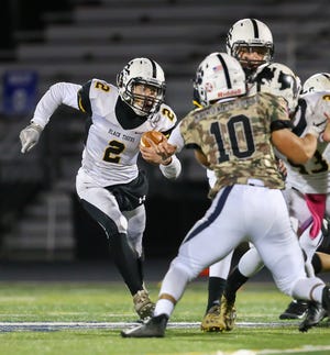 Cuyahoga Falls' Kobe Brown looks for running room during the Black Tigers' 42-0 loss at Twinsburg Oct. 31