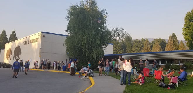 Families gather on the lawn in front of Mount Shasta High School for a Back to School celebration in 2017.