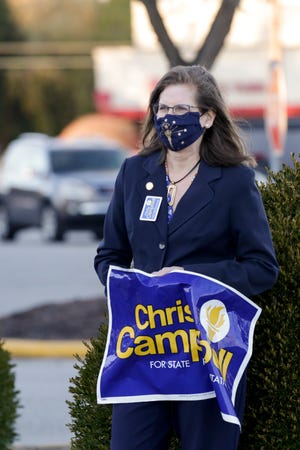 Chris Campbell campaigns outside River City Community Center, Tuesday, Nov. 3, 2020 in Lafayette.