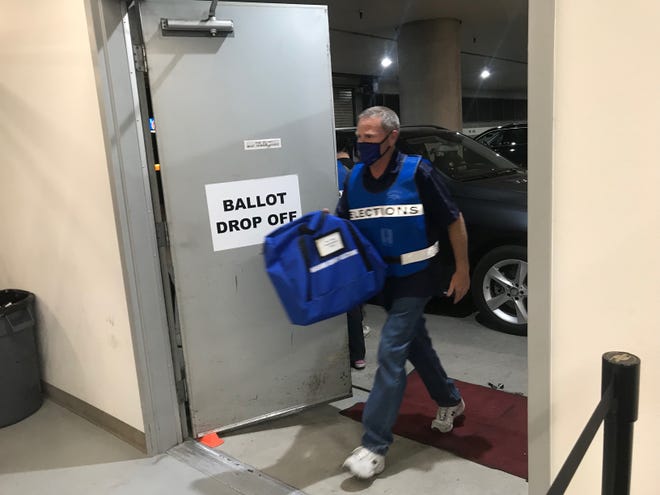 Ballot cartridges arrive at the Washoe County Voter Registrar's Office for counting Nov. 3, 2020.