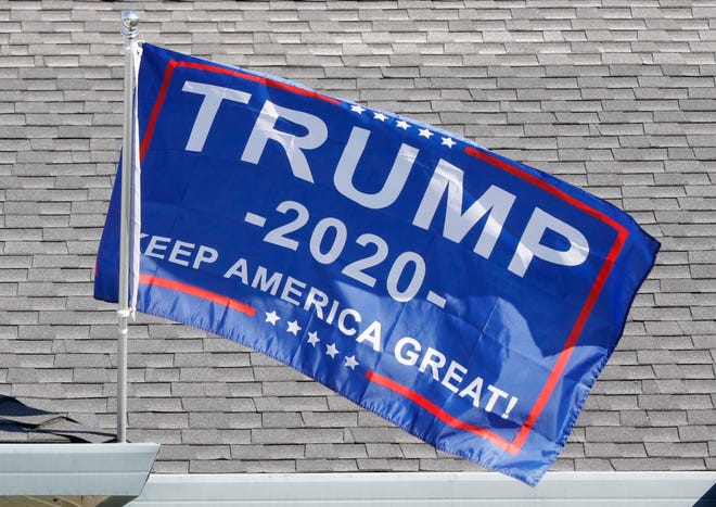 A Donald Trump banner flies at a house in a Shasta County neighborhood before the Nov. 3, 2020, election.