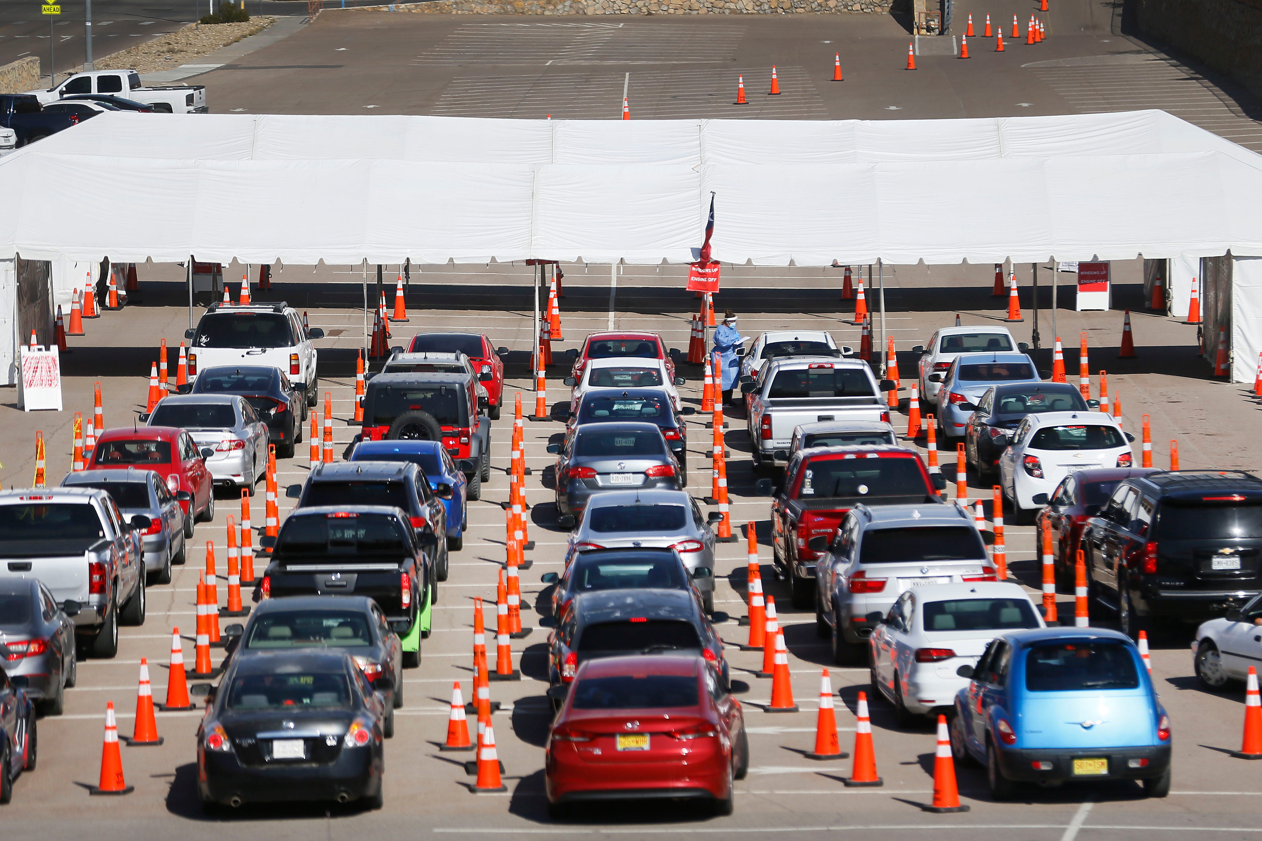 Drivers wait at a drive-through COVID-19 testing site on Nov. 4, 2020, at UTEP. El Paso hospitals are near a breaking point as a staggering 3,100 new COVID-19 infections were reported that morning.