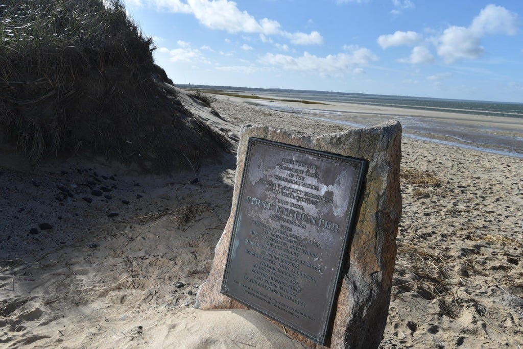 A monument at First Encounter Beach in Eastham describes the Pilgrims' first meeting with the Wampanoag. The beach is the site of a skirmish that led to the Pilgrims leaving to settle in Plymouth.