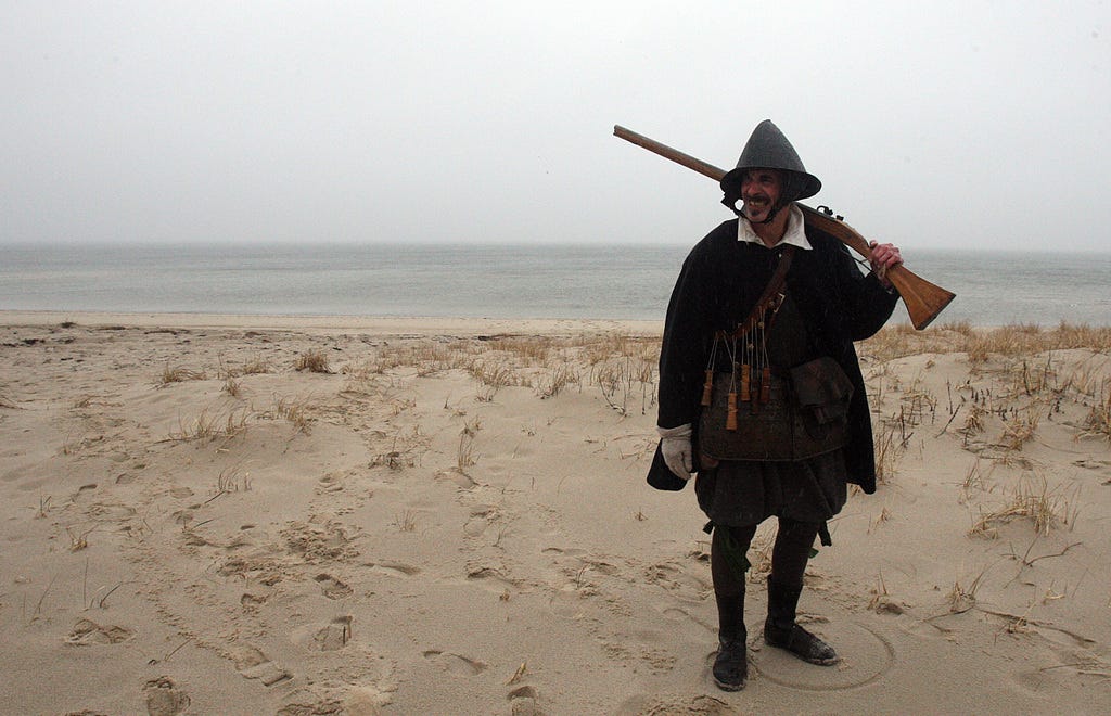 TRURO--031516-- Plimoth Patuxet visits the Cape to study the Pilgrims' three exploratory trips and initial Native/Colonists interactions on their original landscapes. Christopher Messier plays the part of a Pilgrim Sentinel, guarding the women as they wash clothes on the Corn Hill Beach. Steve Haines/Cape Cod Times