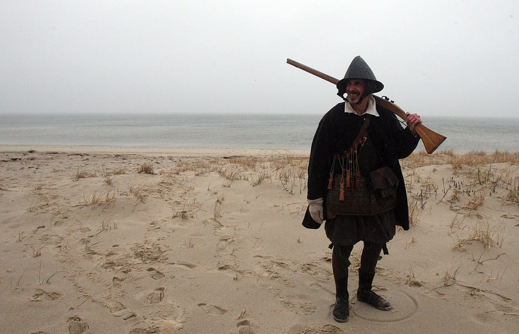 TRURO--031516-- Plimoth Patuxet visits the Cape to study the Pilgrims' three exploratory trips and initial Native/Colonists interactions on their original landscapes. Christopher Messier plays the part of a Pilgrim Sentinel, guarding the women as they wash clothes on the Corn Hill Beach.  Steve Haines/Cape Cod Times