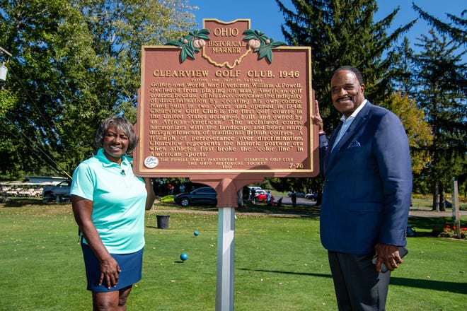 Renee Powell posed for a photo along with James Brown of CBS Sports at the Ohio Historical marker for Clearview Golf Course in 2019.