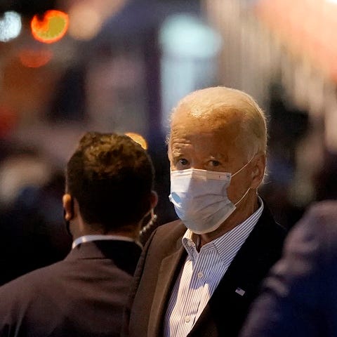 Democratic presidential nominee Joe Biden walks ou