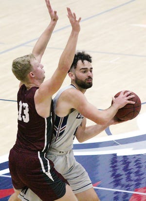 Lense Ramey, right, came off the bench to pump in 22 points for Oklahoma Wesleyan University during last week's overtime loss at Bethel (Kan.) College.