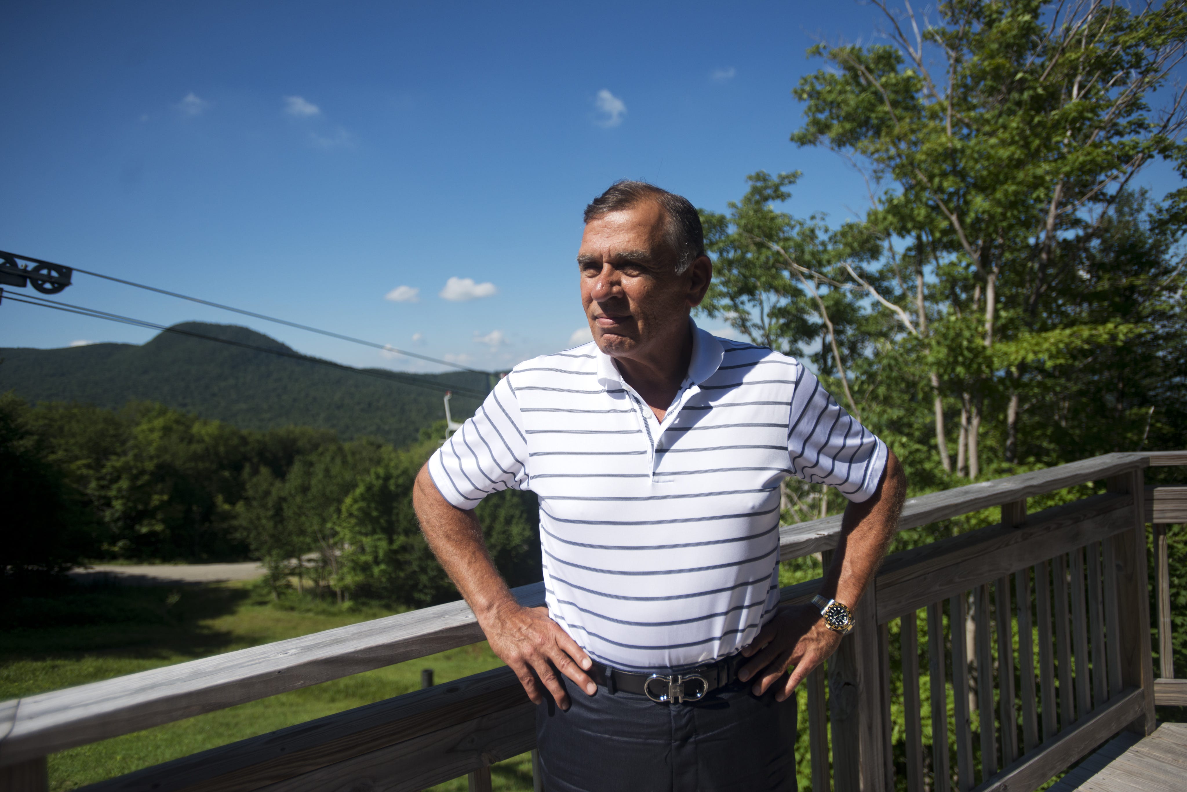 Ariel Quiros, co-owner of Jay Peak and Bill Stenger's business partner, stands on the porch of his condo at Jay Peak in 2013.