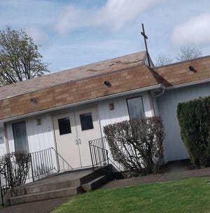 The 9-foot-tall oak cross that graced the roof peak of Pauline Memorial AME Zion Church was stolen on Oct. 12, 2020. The cross was briefly removed to replace siding on the building and taken from the church parking lot.