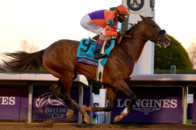 John Velazquez (9) rides Authentic to win the Breeders' Cup Classic horse race at Keeneland Race Course, in Lexington, Kentucky, on Saturday, Nov. 7, 2020.