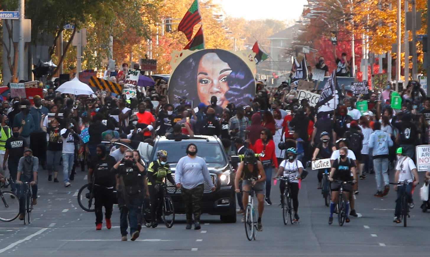 Protesters move the Breonna Taylor memorial from Jefferson Square Park to Roots 101 Saturday evening. 
11/07/20