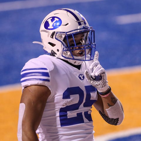 BYU running back Tyler Allgeier celebrates a first