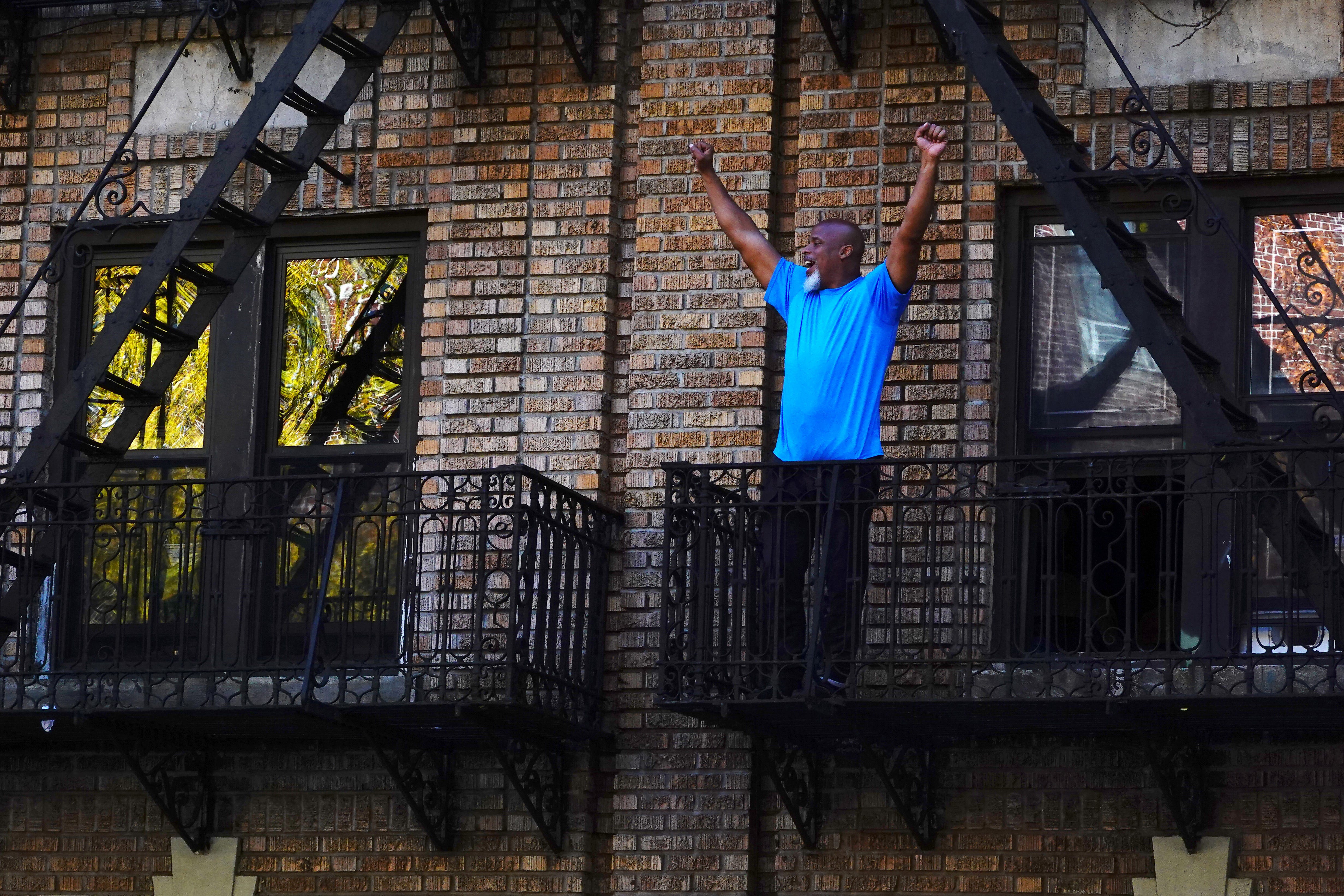 A man celebrates in the Flatbush neighborhood of Brooklyn after Joe Biden was declared winner.