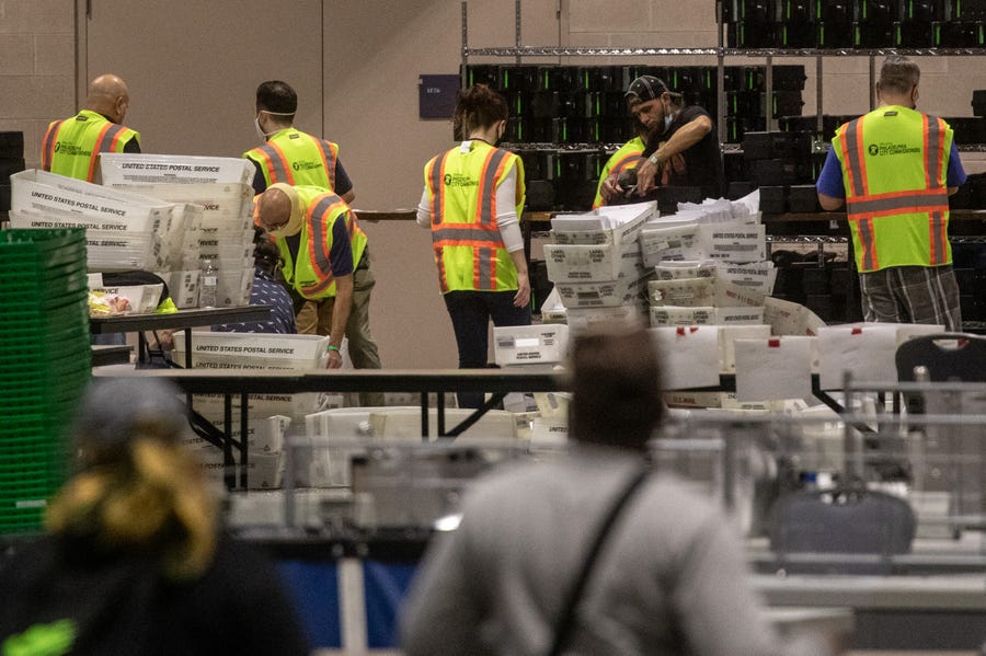 Election workers count ballots at the Philadelphia Convention Center on Nov. 6.