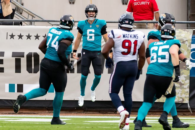 Jacksonville Jaguars quarterback Jake Luton (6) celebrates a rushing touchdown in the fourth quarter during the Jaguars vs. Texans game at TIAA Bank Field in Jacksonville, FL on Sunday, November 8, 2020. [Matt Pendleton/Special to the Times-Union]