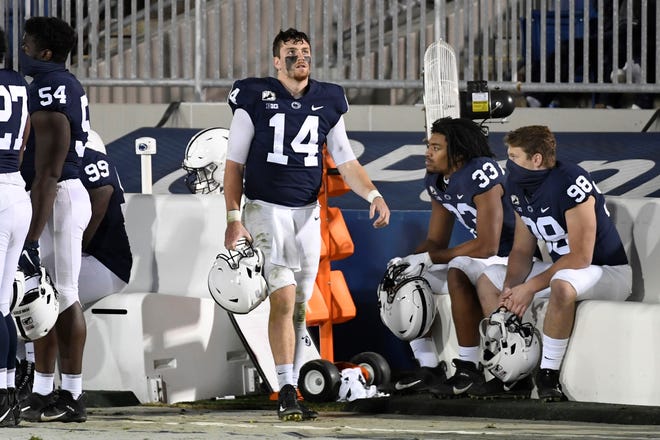 Penn State quarterback Sean Clifford (14) looks at the scoreboard in the last minute of the fourth quarter of an NCAA college football game in State College, Pa., Saturday, Nov. 7, 2020. (AP Photo/Barry Reeger)