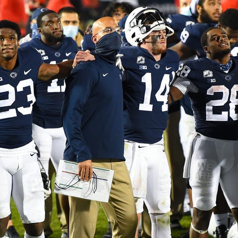 Penn State coach James Franklin stands with quarte