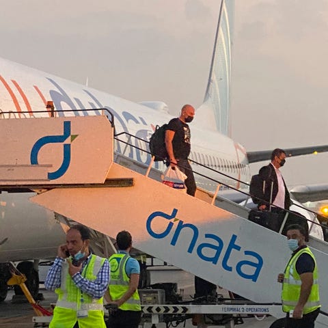 Israeli tourists leave a flydubai plane which depa