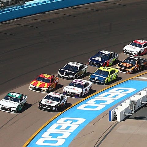 Cup Series cars approach the start line during the