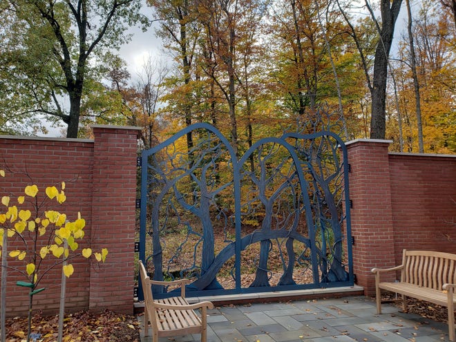 Norton sculptor Virgil Villers created "Woodland Window," a whimsical, three-dimensional aluminum structure that spans a 13-foot opening providing a view of the woods and nearby allee at Kingwood Center Gardens in Mansfield.