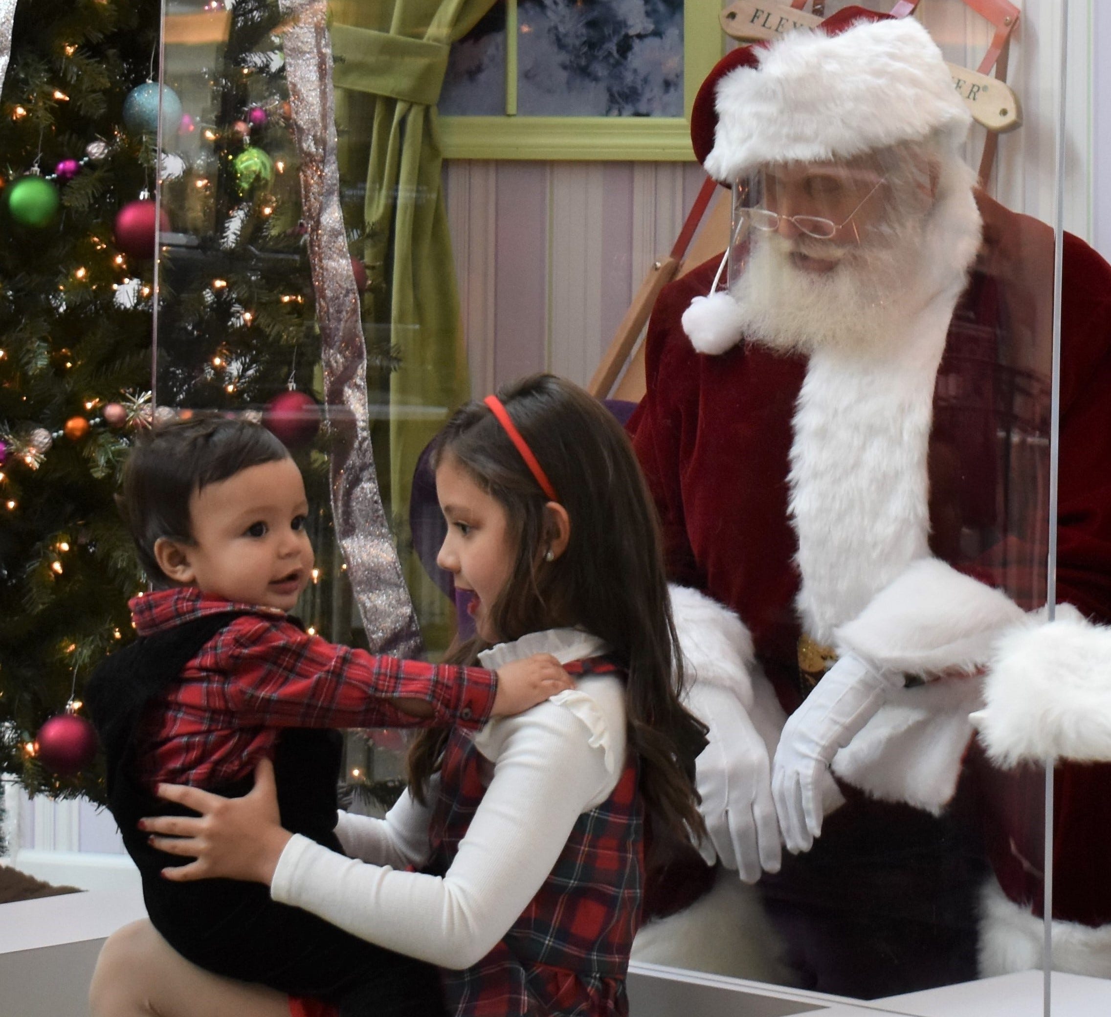 Cherry Hill Mall Christmas 2022 Santa Claus Wears A Face Mask And Sits Behind A Plastic Shield This Year