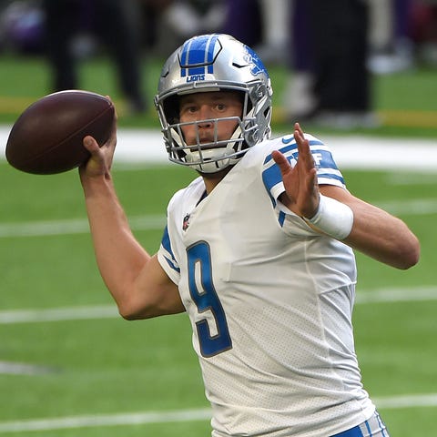 Detroit Lions quarterback Matthew Stafford, left, 